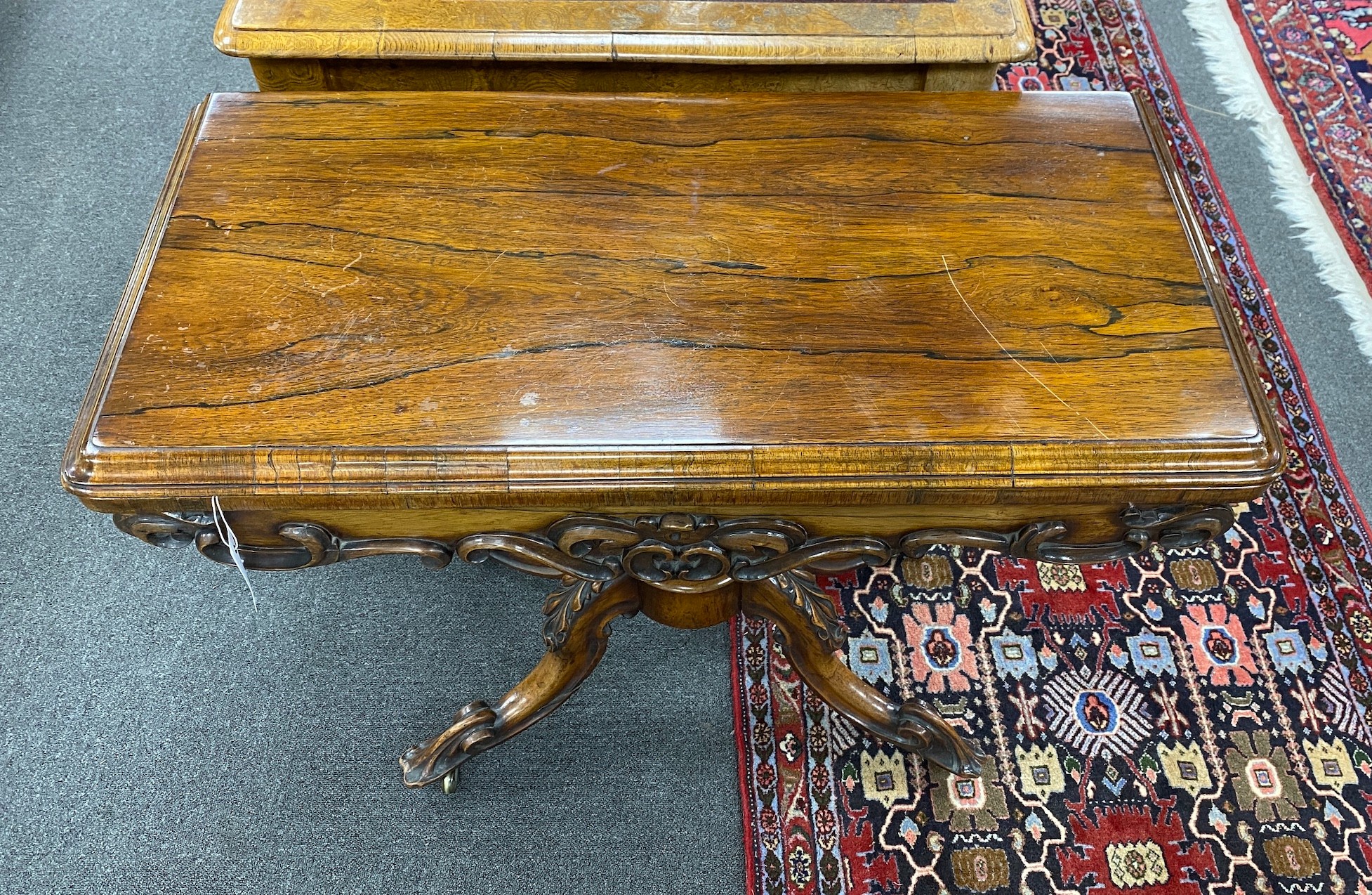 An early Victorian rectangular rosewood folding card table width 92cm, depth 45cm, height 73cm